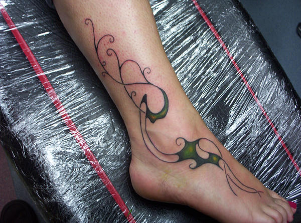 tribal leg tattoo by