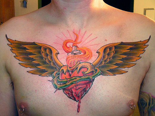 Sacred Heart with wings - chest tattoo