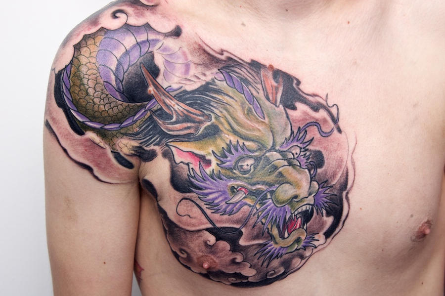 dragon on chest - chest tattoo